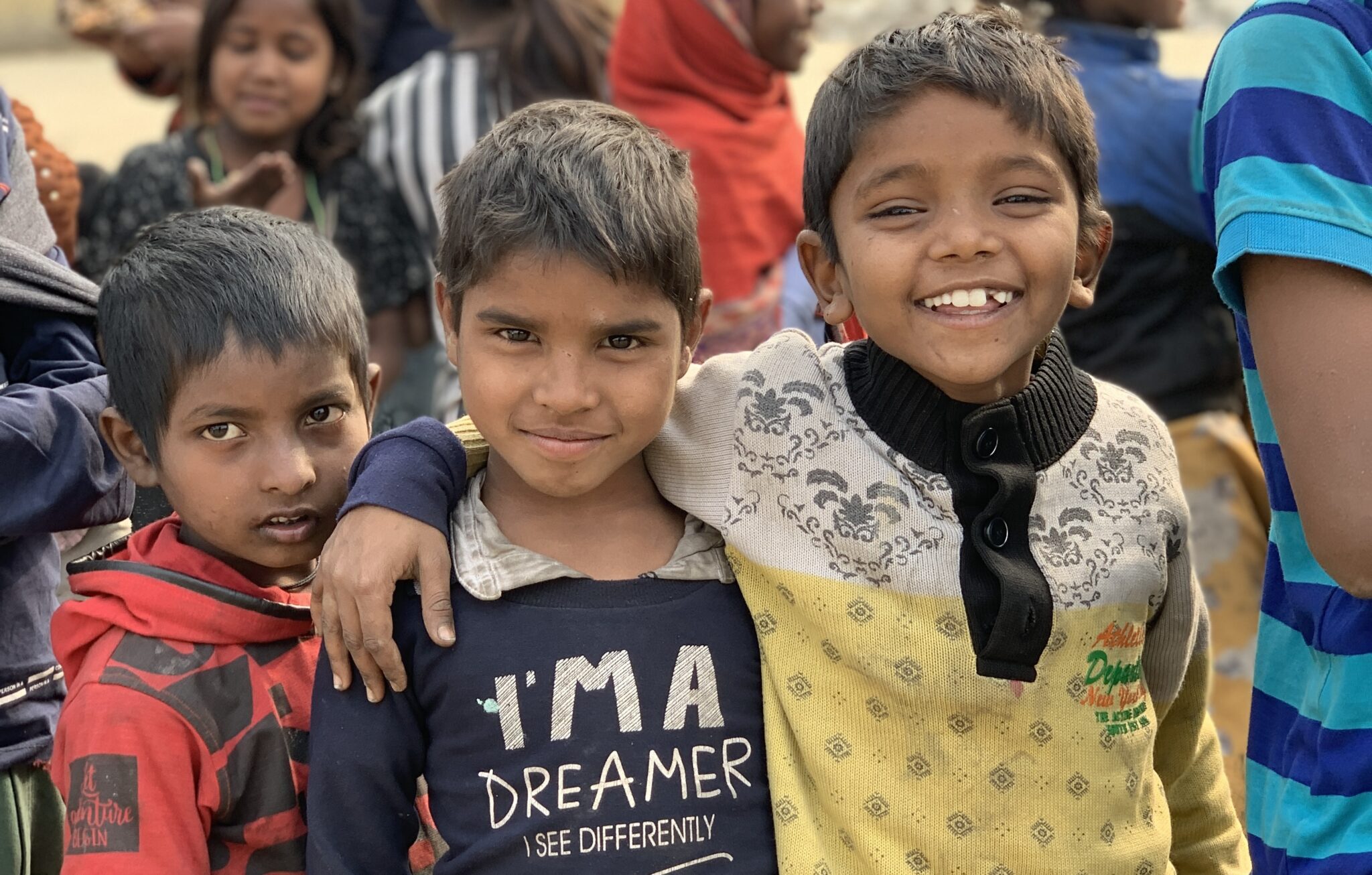 Group of happy children with volunteers